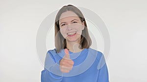 Thumbs Up by Young Woman on White Background