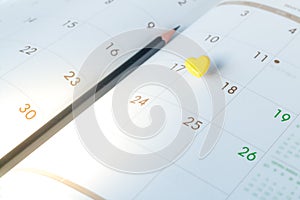 Thumbtack in calendar concept