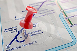 Thumbtack on Heathrow station in london underground map