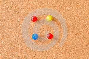 Thumbtacks on cork board