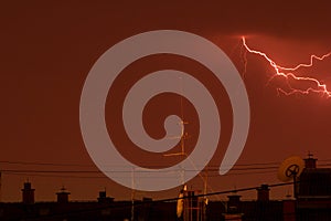 Thunder lightning over the city rooftops
