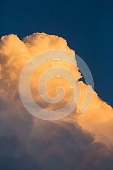 Thunder storm clouds approack in blue sky