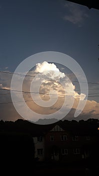 Thunder storm clouds gathering pace towering clouds