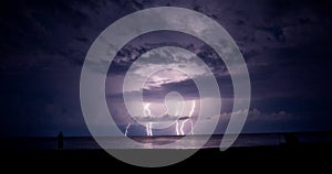 Thunder-storm and lightning in the sea photo