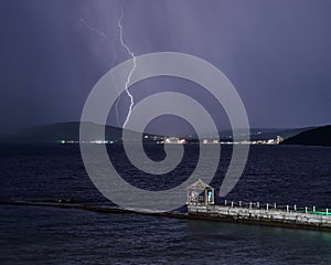 Thunder-storm and lightning on the sea