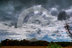 Thundercloud with possible formation of a tornado with a slight