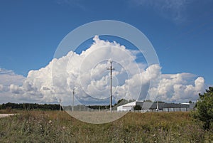 Thundercloud in the sky over the field landscape of nature in Siberia