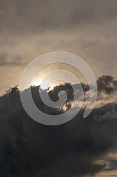 Thunderclouds. dramatic scene. The sun is swallowed up by clouds