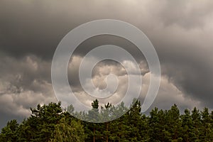 Thunderclouds. dramatic scene. The sun is swallowed up by clouds