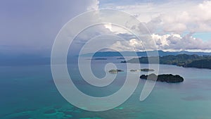 Thunderclouds over the sea. Seascape with clouds and islands. Caramoan Islands, Philippines.