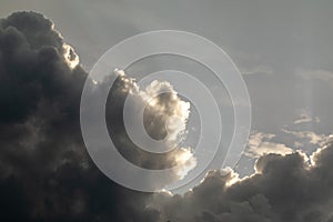 Thunderclouds. The sky after the rain. Beautiful clouds. Dramatic thunderstorm clouds with sun rays