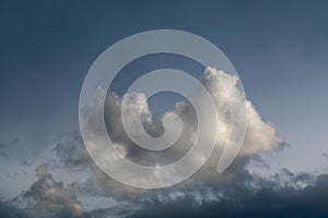 Thunderclouds. The sky after the rain. Beautiful clouds. Dramatic thunderstorm clouds with sun rays