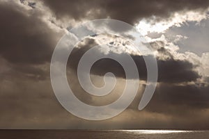 Thunderclouds with Tracer Beams over the Stormy Sea