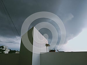 Thundering cloud on building photo