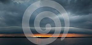 Thunderous sunset over the evening river