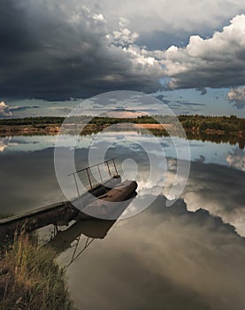 A thunderstorm is approaching, nature froze in anticipation of a storm swirling, swirling clouds of rain.