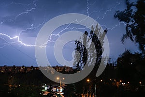 Thunderstorm in the city in the night thunderbolt
