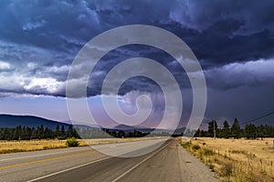 Thunderstorm heavy dark blue sky with clouds hard rain in the horizon