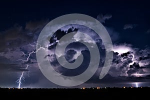 Thunderstorm illuminated by lightning