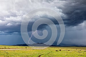 Thunderstorm lightning strike and dark storm clouds