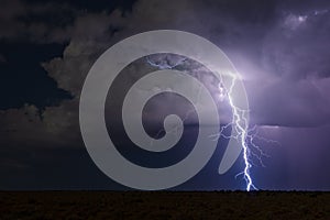 Thunderstorm lightning bolt strike and storm clouds