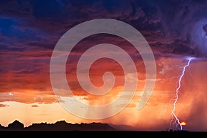 Thunderstorm lightning bolt strike at sunset