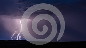 Thunderstorm lightning bolt strikes at night