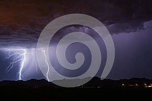 Thunderstorm lightning bolt strikes and stormy sky