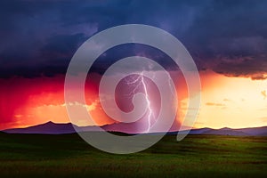 Thunderstorm lightning bolt at sunset