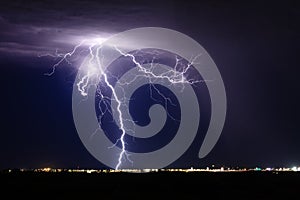 Thunderstorm lightning strike over a city