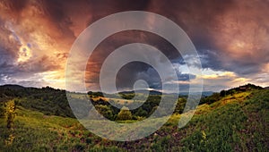 Thunderstorm In The Mountains. Panoramic Summer Landscape With Enchanting Stormy Sky, Storm Clouds, Sunny Valley And Small Rural H