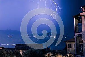 Thunderstorm in the night: Lightning on the sky, neighbourhood, Italy