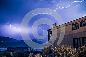 Thunderstorm in the night: Lightning on the sky, neighbourhood, Italy