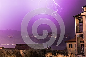 Thunderstorm in the night: Lightning on the sky, neighbourhood, Italy