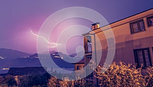 Thunderstorm in the night: Lightning on the sky, neighbourhood, Italy