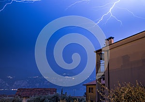 Thunderstorm in the night: Lightning on the sky, neighbourhood, Italy