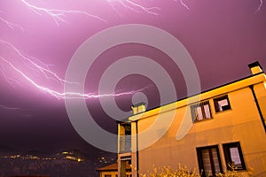 Thunderstorm in the night: Lightning on the sky, neighbourhood, Italy