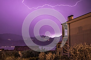 Thunderstorm in the night: Lightning on the sky, neighbourhood, Italy