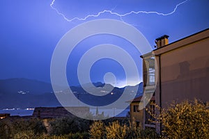 Thunderstorm in the night: Lightning on the sky, neighbourhood, Italy