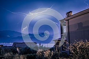 Thunderstorm in the night: Lightning on the sky, neighbourhood, Italy