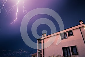 Thunderstorm in the night: Lightning on the sky, neighbourhood, Italy