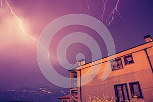 Thunderstorm in the night: Lightning on the sky, neighbourhood, Italy