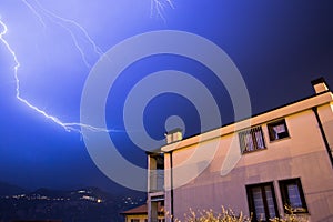 Thunderstorm in the night: Lightning on the sky, neighbourhood, Italy