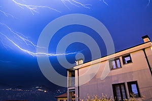 Thunderstorm in the night: Lightning on the sky, neighbourhood, Italy