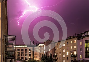Thunderstorm in the night: Lightning on the sky, urban city, 