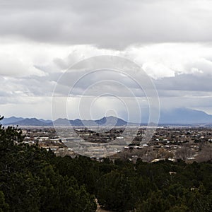 Thunderstorm obscuring the Ortiz mountains from across Santa Fe New Mexico photo