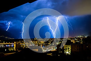 Thunderstorm over little city lightning strike