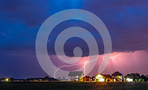 Thunderstorm with rain over the village street