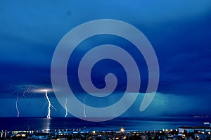 Thunderstorm and stormy clouds full of rain and city scape, horizon