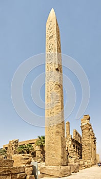 Thutmose I Obelisk with the 3rd Pylon and the South side Hypostyle Hall in background in Karnak Temple complex near Luxor, Egypt.